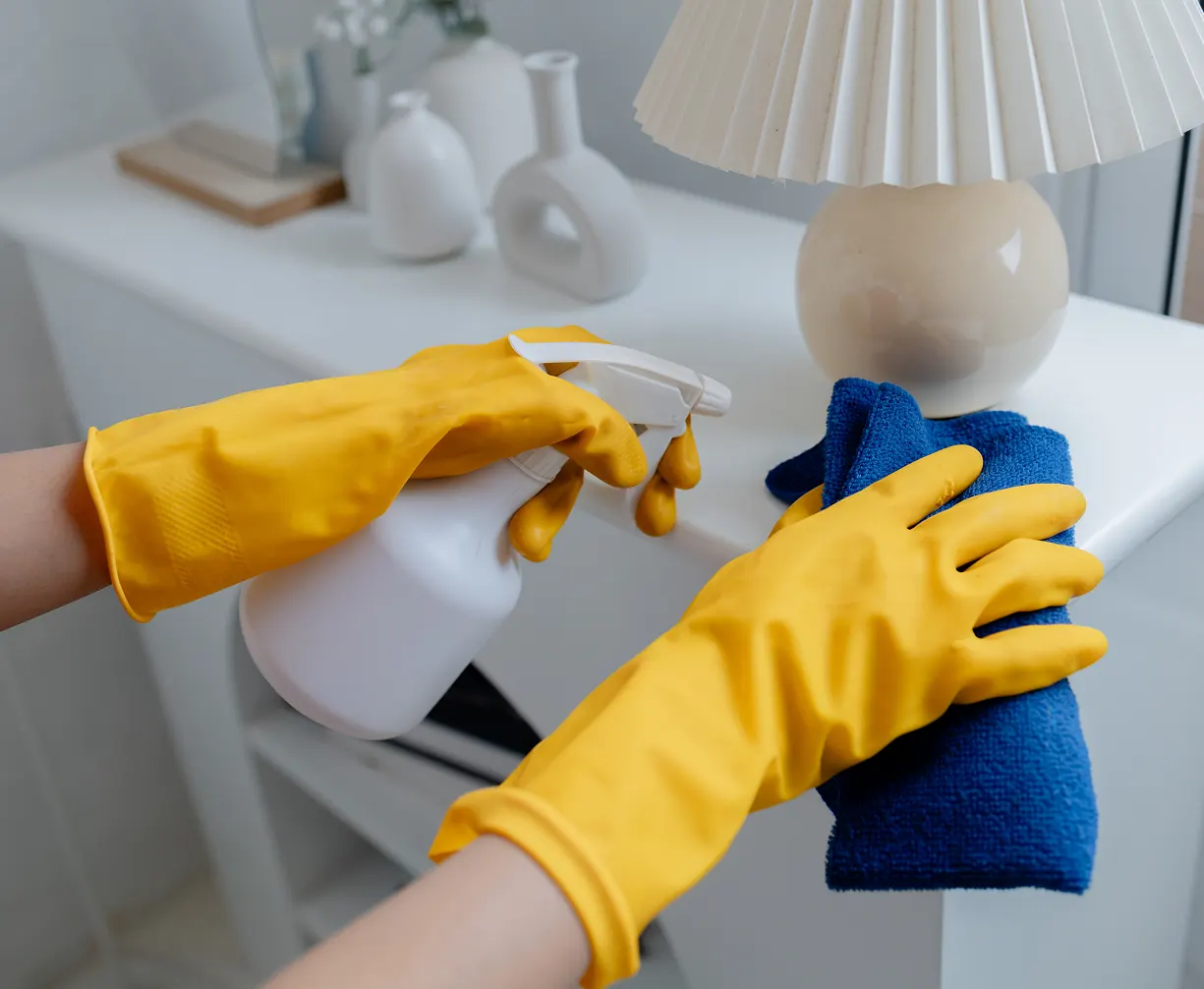 Asian woman cleaning staff housekeeper cleaning the white surface